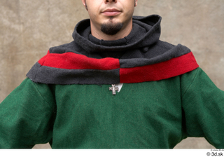  Photos Medieval Servant in suit 4 Green gambeson Medieval clothing grey red and hood medieval servant upper body 0002.jpg